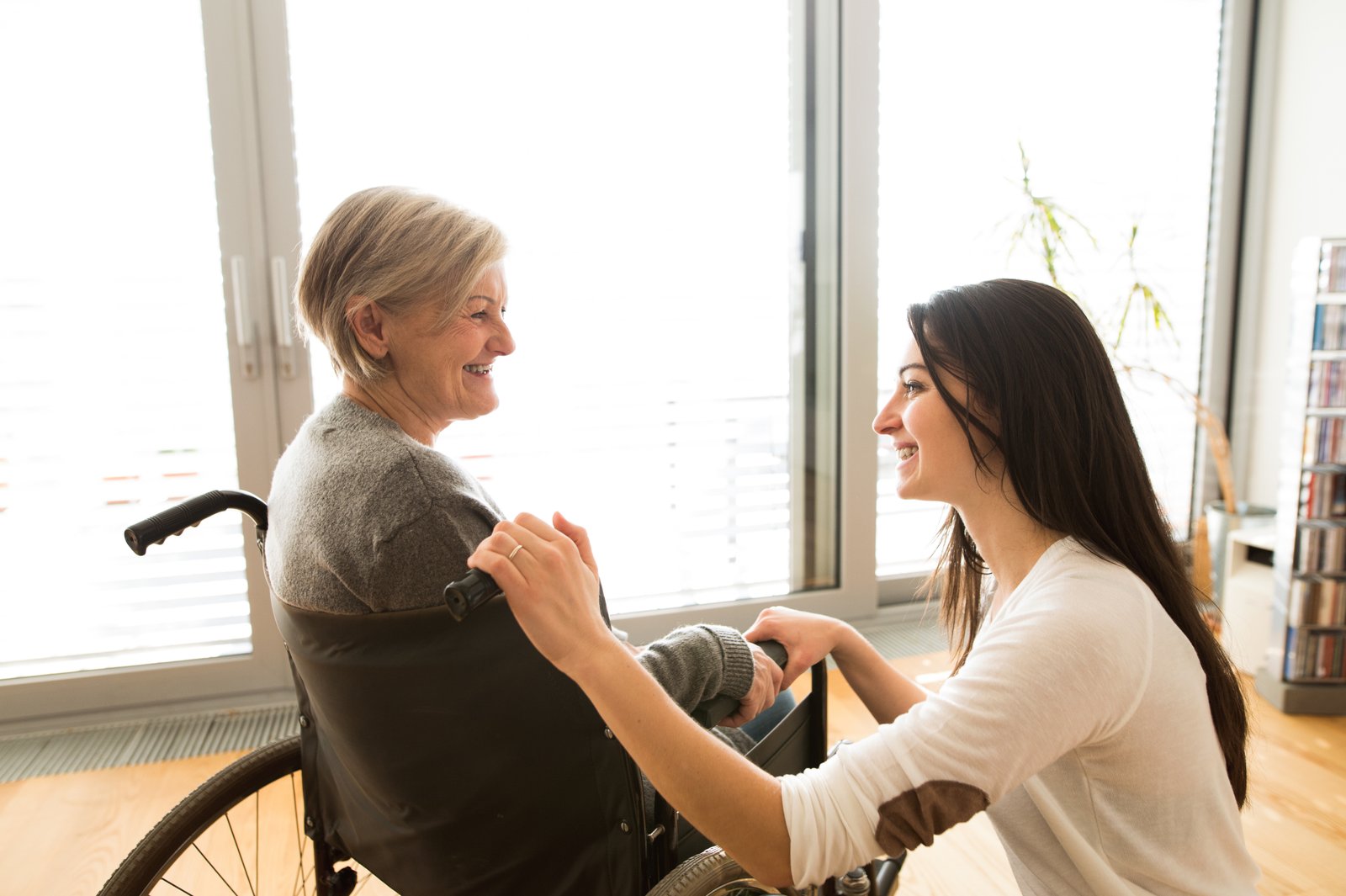 Mother and adult daughter caregiving together